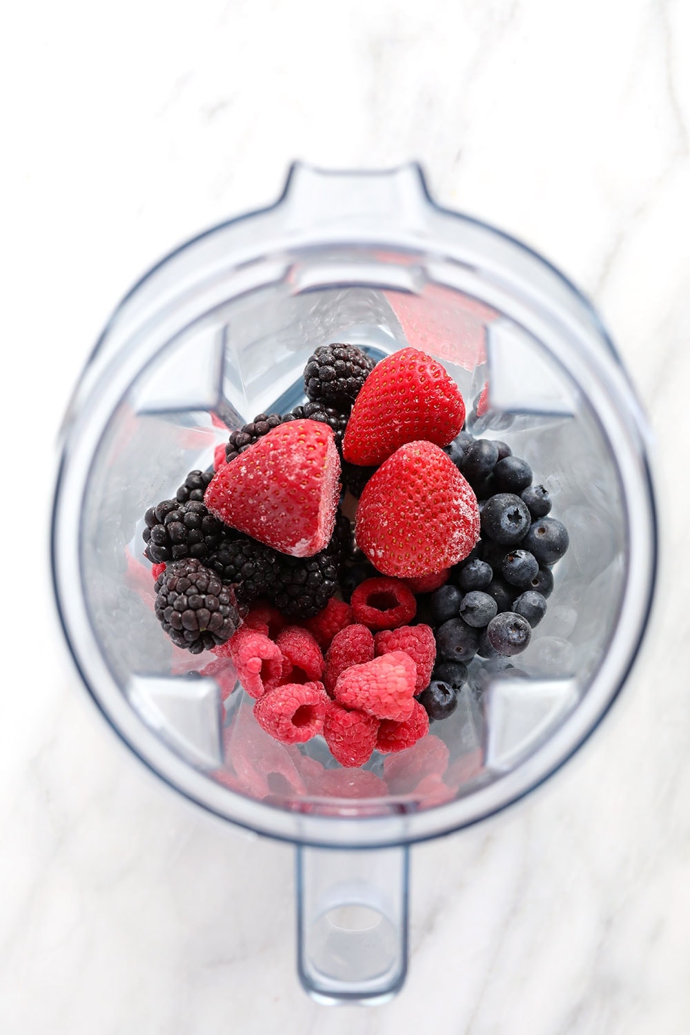 frozen berries in a blender