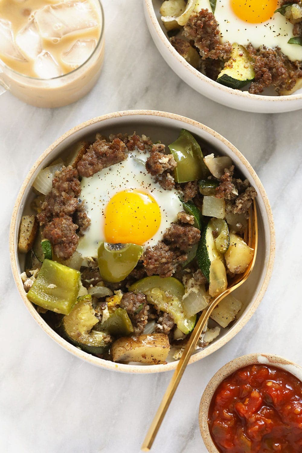 Good morning! This Garden Breakfast Hash is protein-packed, flavorful, and a perfect dish to feed the entire family this weekend! garden breakfast hash in a bowl topped with an egg