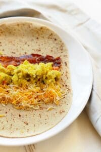 a breakfast burrito with eggs and cheese.