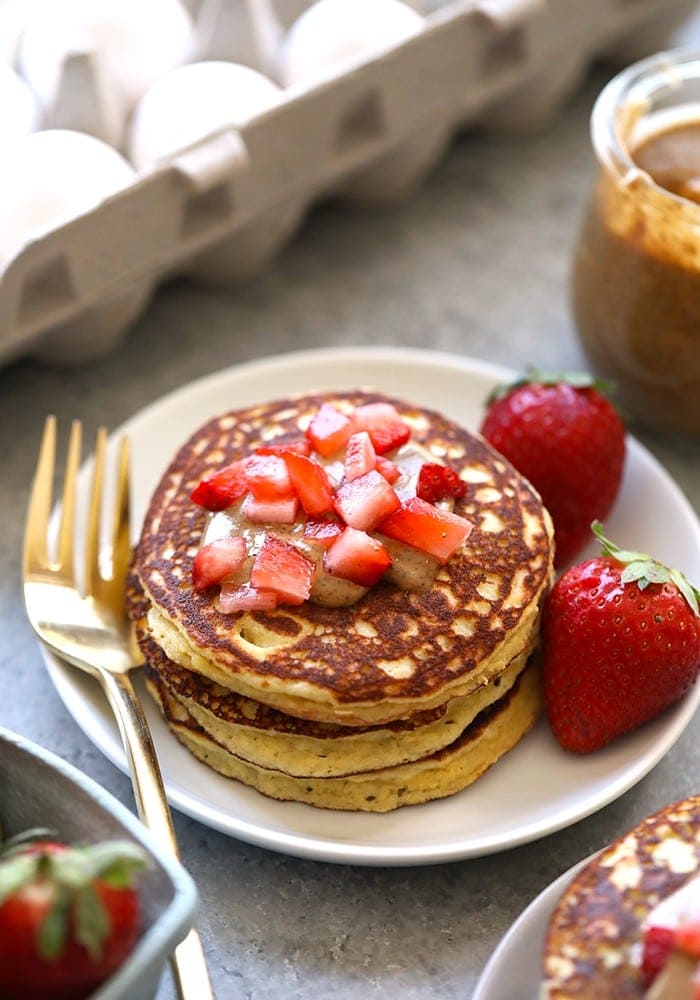 These 3 Ingredient Almond Flour Banana Pancakes are grain-free, dairy-free, and a super healthy way to start your day! Make them for a healthy breakfast in the morning or make a double batch and store them in the freezer for the week. stack of almond flour pancakes