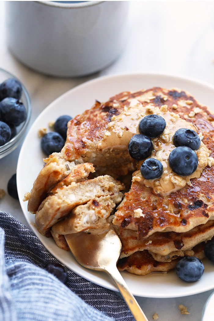 Cottage Cheese Protein Pancakes for the win! Who's with me? If you're all about healthy pancakes and getting a protein boost at the same time then you will love this protein pancake recipe! They're made with 100% ground oat flour, cottage cheese, and mashed banana. cottage cheese pancakes on plate.