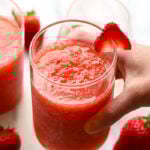 The most delicious summer drink you ever did see! This Strawberry Peach Frose Recipe is such a fun frozen drink to make for a crowd. This blended frose recipe calls for a full bottle of rose, frozen strawberries and peaches, rum, and agave nectar!