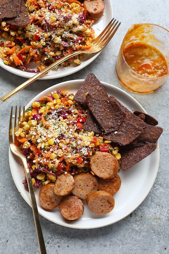 Enjoy this Thai Chili Corn Salad as a side to any of your favorite main dishes. This corn salad will be a new family favorite! Corn salad with a side of sausage and chips