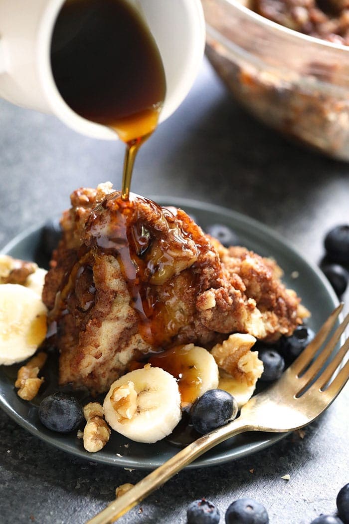 This Instant Pot Cinnamon Roll French Toast Casserole is a delicious breakfast or brunch for any time of year. Don't have a stove? Don't worry, this french toast casserole is made completely in the Instant Pot. French Toast Casserole being drizzled with maple syrup