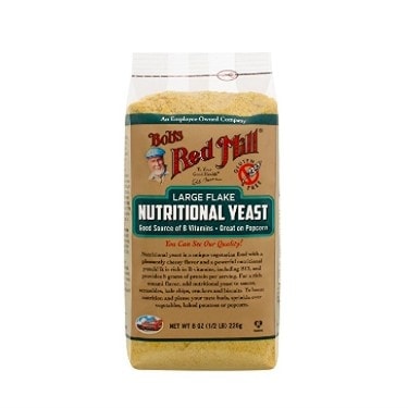a bag of vegan nutritional yeast on a white background.