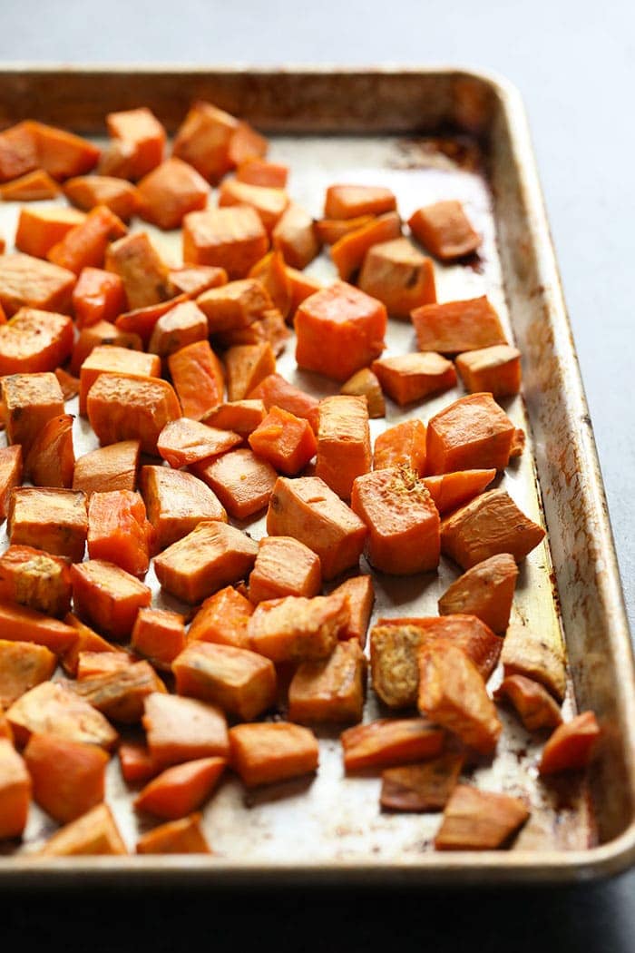 diced sweet potatoes on a baking sheet
