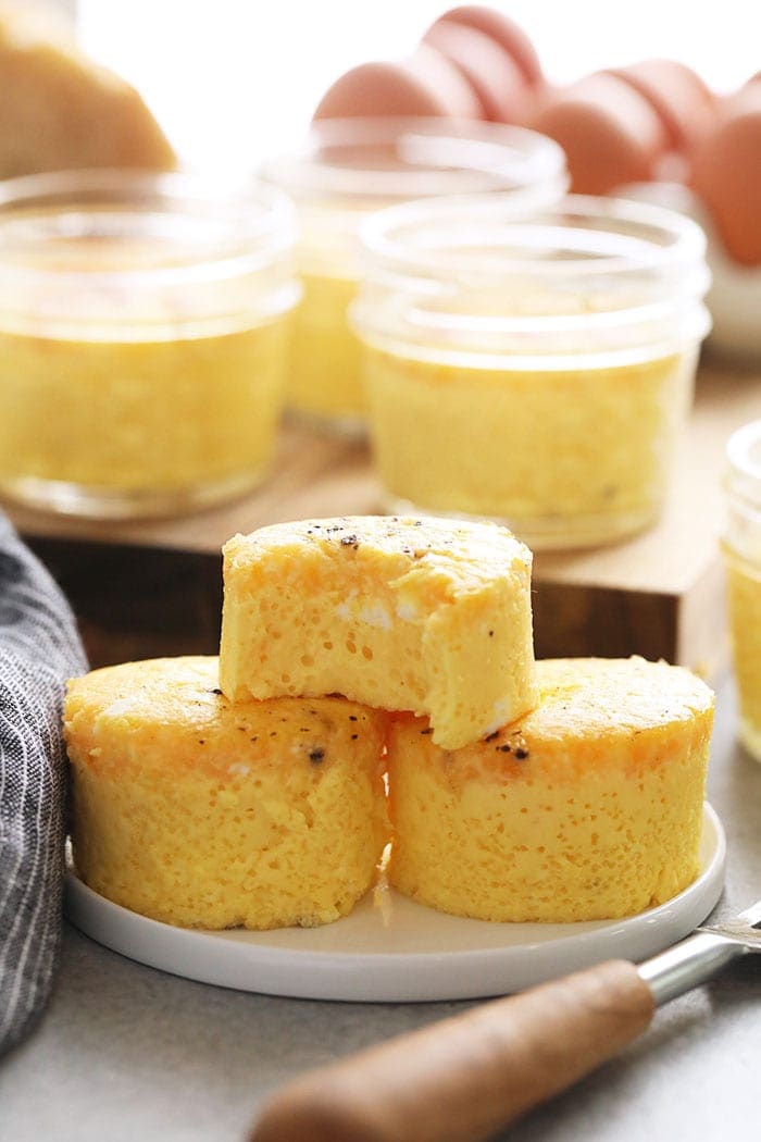 Love the Starbucks Sous Vide Egg Bites? Make your very own recipe at home! You're going to absolutely love these Cheesy Sous Vide Egg Bites. They're made with 3 basic ingredients and done in under 60 minutes. Sous Vide Egg Cups stacked on eachother