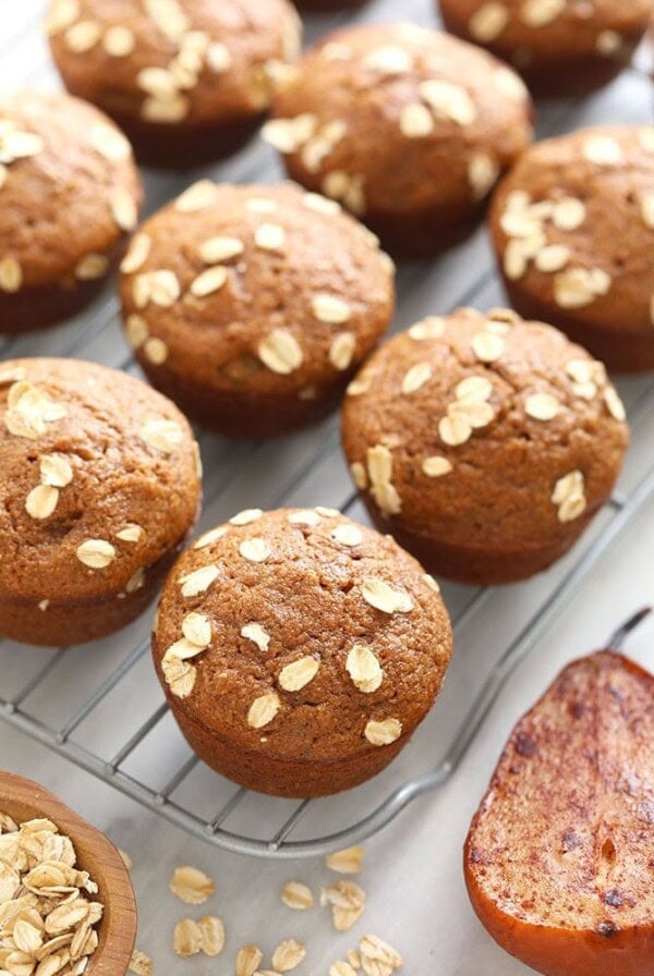 Pear muffins cooling on a rack.