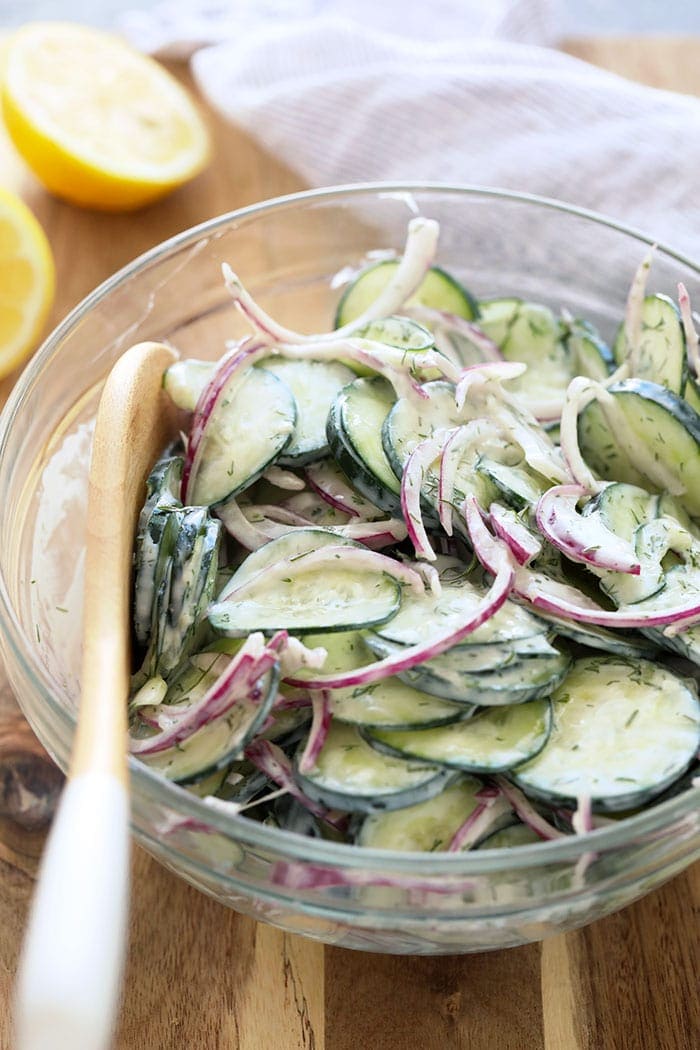 If you are looking for a healthy side salad for your next BBQ or a healthy salad for meal prep, look no further! This creamy cucumber salad is simple, flavorful, and delicious. Creamy cucumber salad in a bowl
