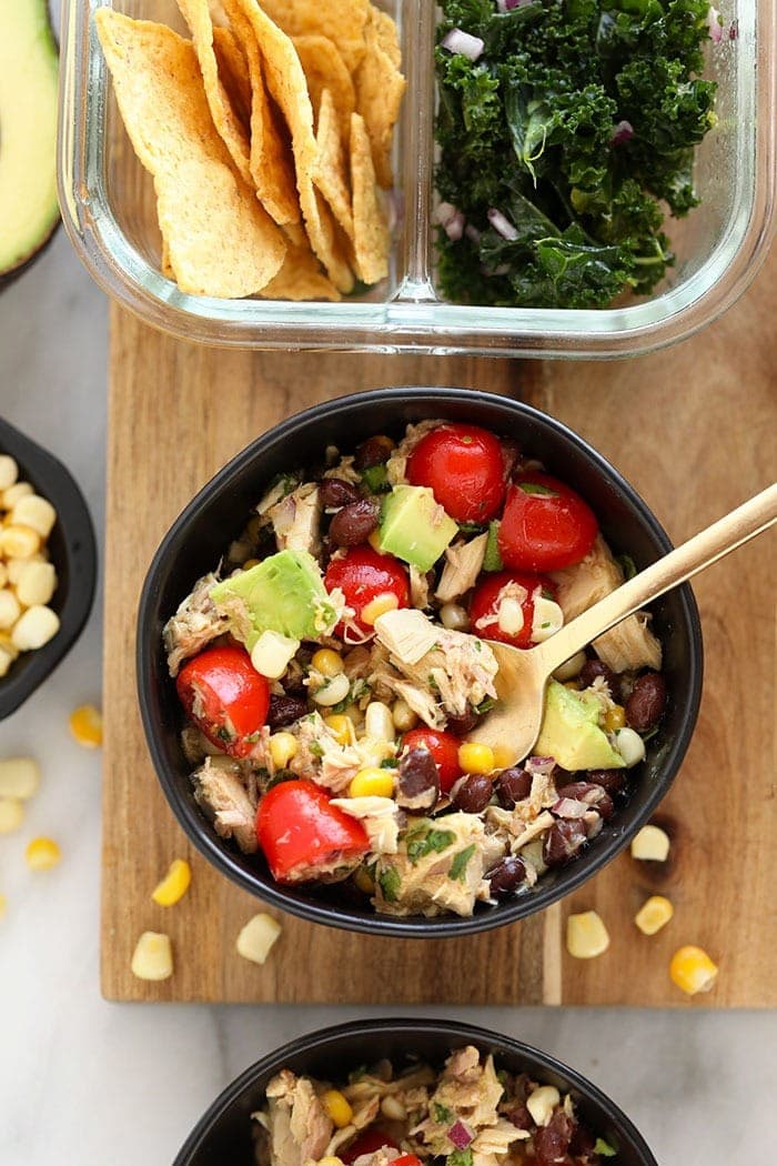 Tuna salad never looked so fresh! Make this colorful healthy tuna salad recipe with a Mexican twist using black beans, cherry tomatoes, corn, and cilantro. Fiesta Tuna Salad