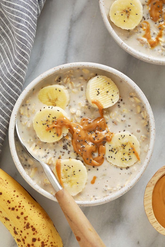 With mashed bananas and Greek yogurt, these Creamy Banana Overnight Oats are the perfect start to the day! Make a batch of these overnight oats today, and enjoy for breakfast all week long. This healthy overnight oats recipe is calling your name! creamy banana overnight oats in a bowl