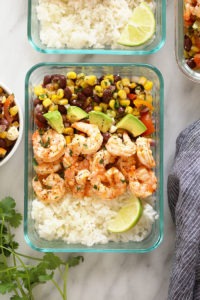 Grilled shrimp in a meal prep bowl.