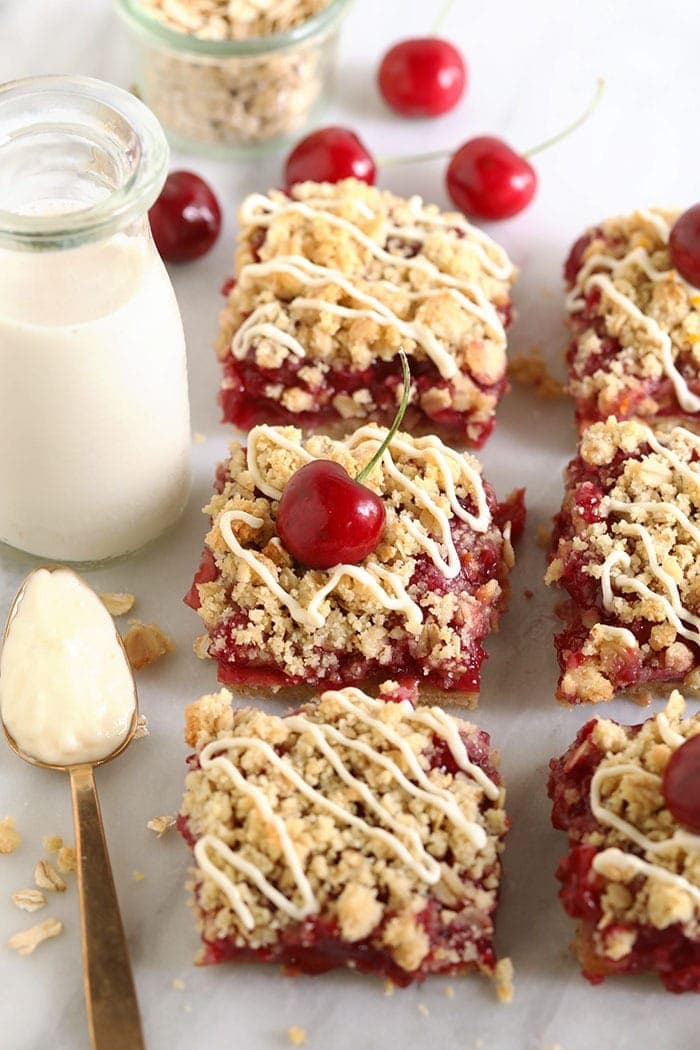 Make these cherry cobbler bars the next time you need a little sweet treat! These cherry cobbler bars are made with fresh cherries and a delicious almond flour crust. Have no fear, cherry season is here! cherry pie bars on a cutting board