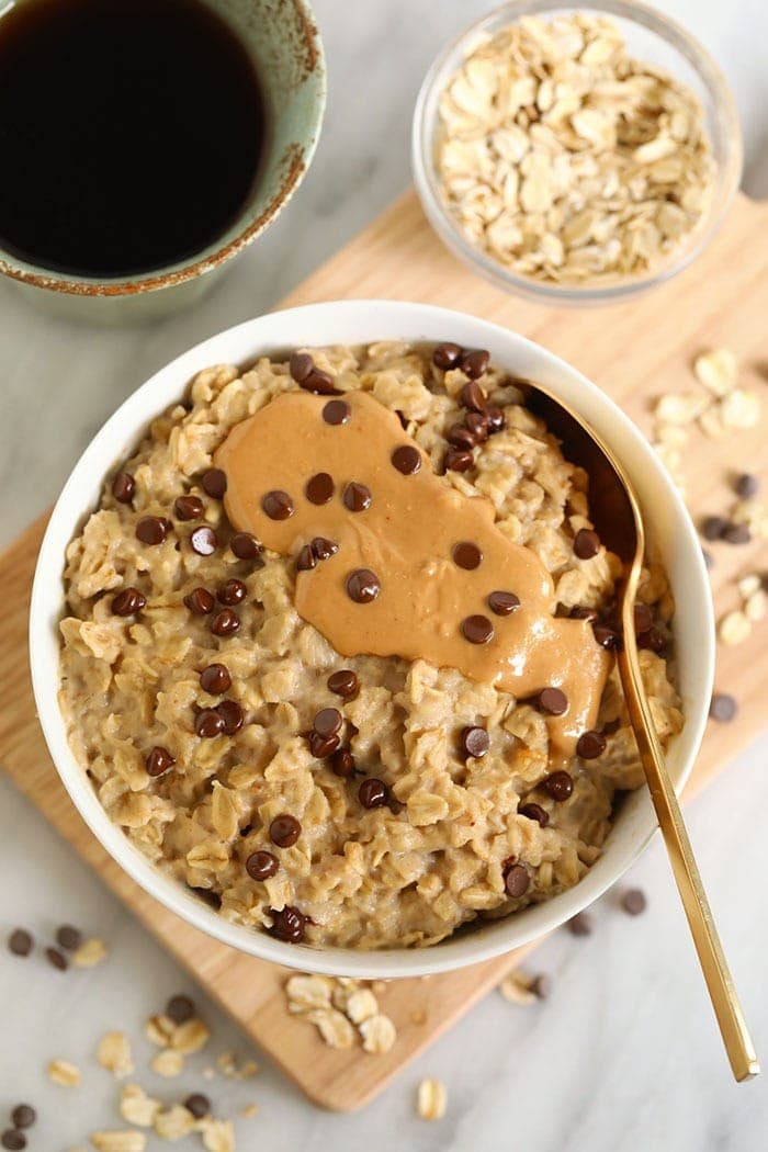 Got 2 minutes? Then, you have time for a healthy breakfast! Make our 2-Minute Microwave Oatmeal. This recipe tastes exactly like chocolate chip cookie dough AND it's healthy. bowl of oatmeal with cashew butter and chocolate chips