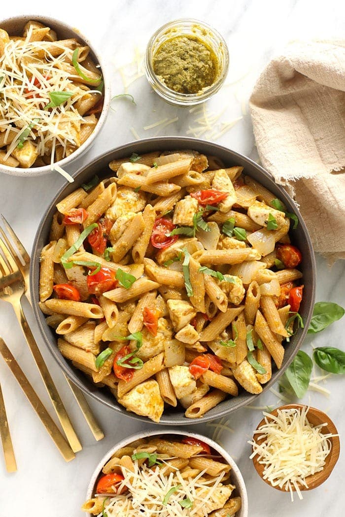 You can't go wrong with a bowl of pesto chicken pasta for dinner! This pesto chicken pasta is ready in under 30 minutes and packed with delicious, fresh flavors! Pesto chicken pasta in a bowl.