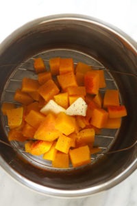 Instant Pot Butternut Squash pieces served in a stainless steel bowl.