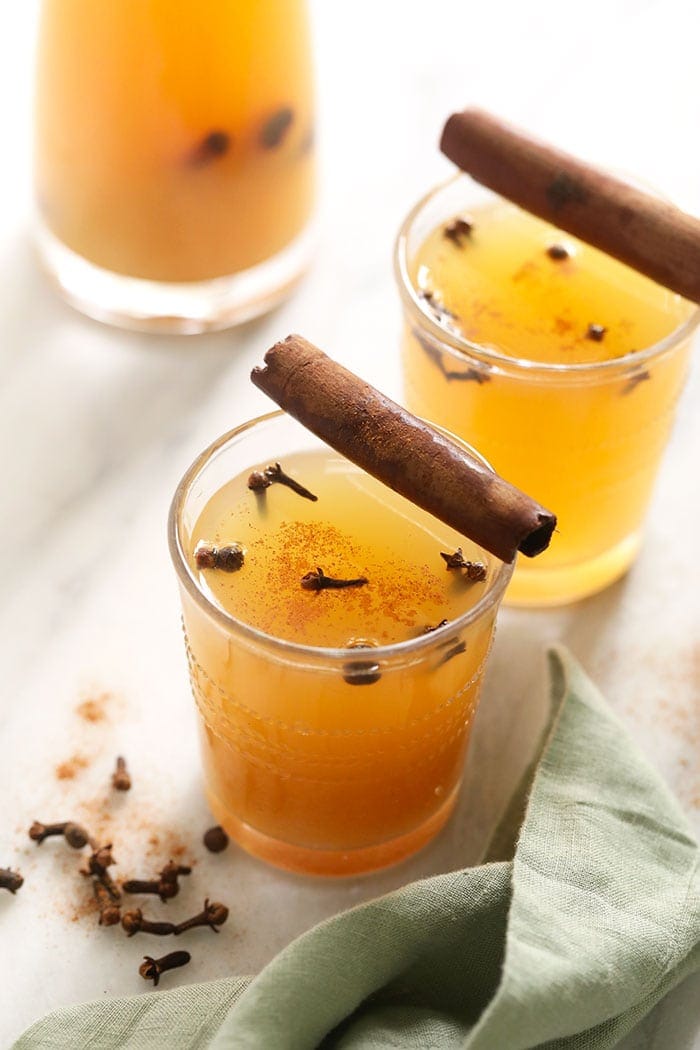 There is nothing like a big mug of hot apple cider. Make yourself some homemade apple cider this season and make it in the Instant Pot! Apple cider in a glass