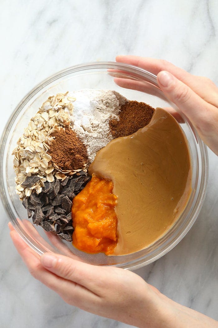 bowl of ingredients for pumpkin oatmeal cookie bars