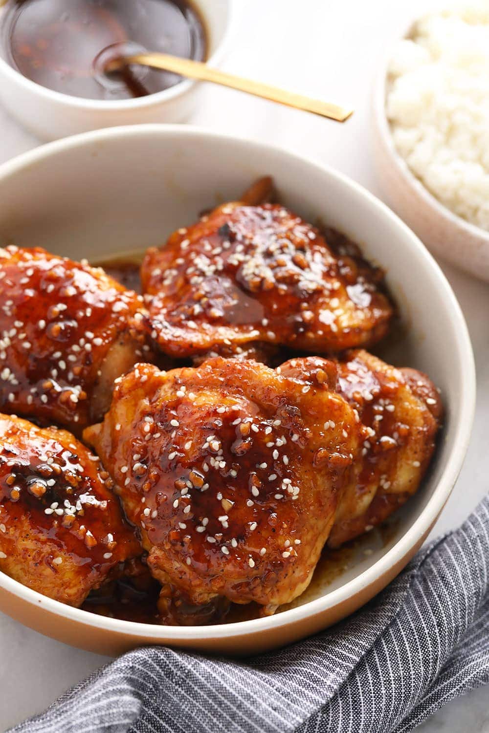 Ready for the most delicious Instant Pot Chicken Thighs recipe on the internet? Say hello to these sticky, sweet Instant Pot Honey Garlic Chicken Thighs. honey garlic instant pot chicken thighs in bowl.