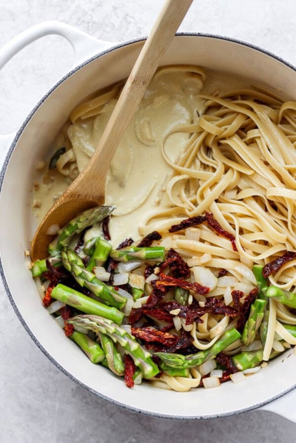 creamy vegan asparagus pasta in a dutch oven