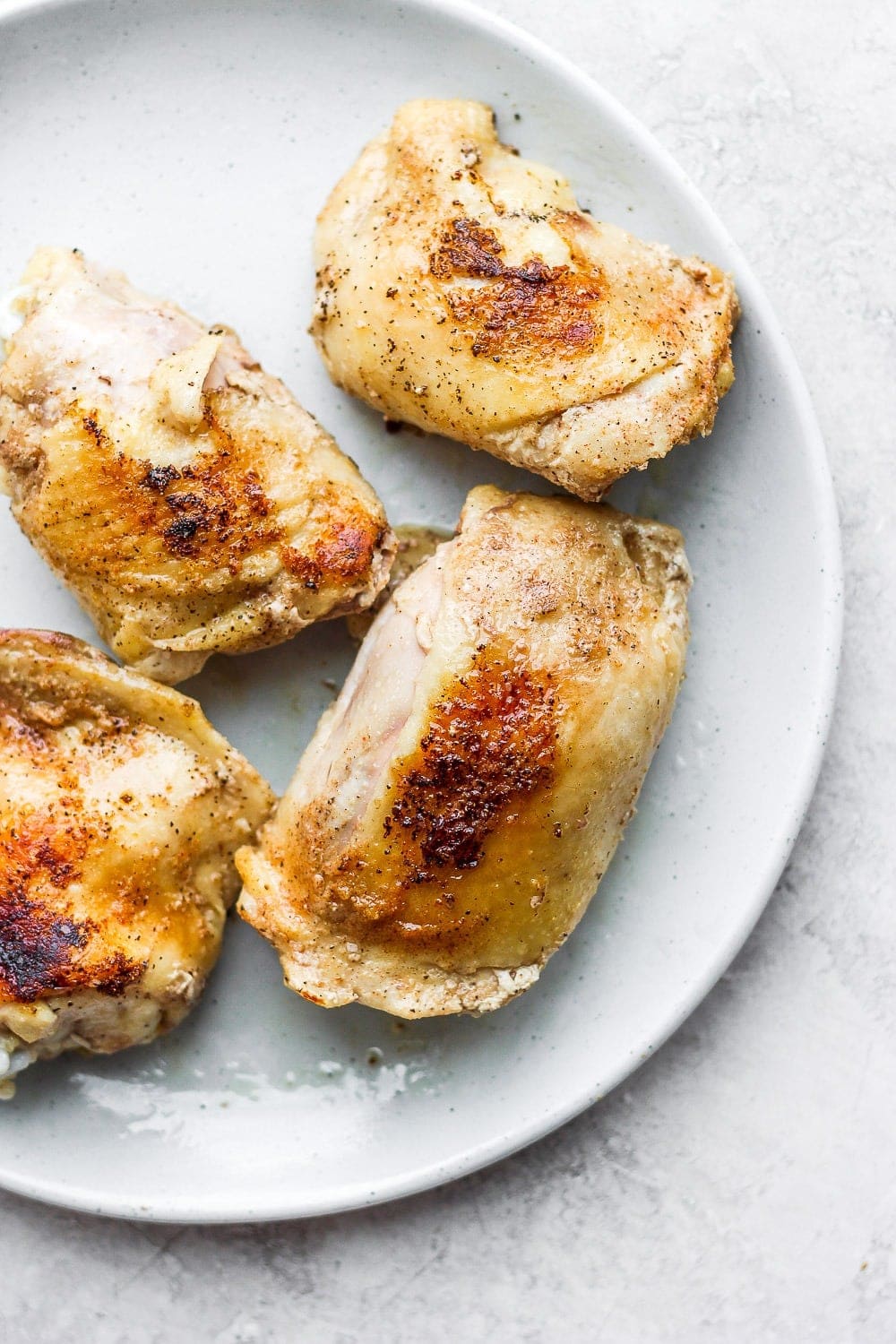 Make our bone-in sous vide chicken thighs. They are perfectly cooked on the inside and crunchy deliciousness on the outside! chicken thighs on plate