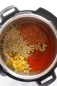 An Instant Pot filled with lentils and spices for making delicious lentil tacos.
