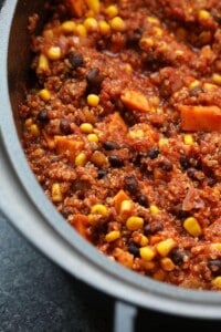 A slow cooker filled with Mexican quinoa after cooking.