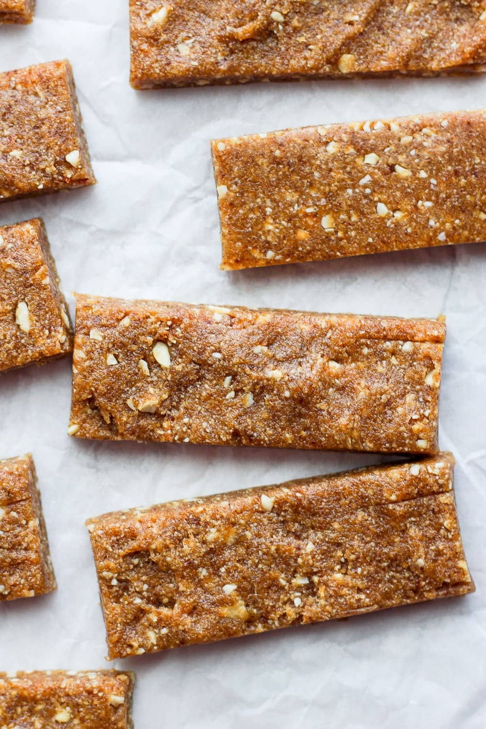 With just 3 simple ingredients you can make these Copycat Cashew Cookie Larabars that are grain-free, refined-sugar-free, vegan, and kid-friendly! larabars on parchment paper