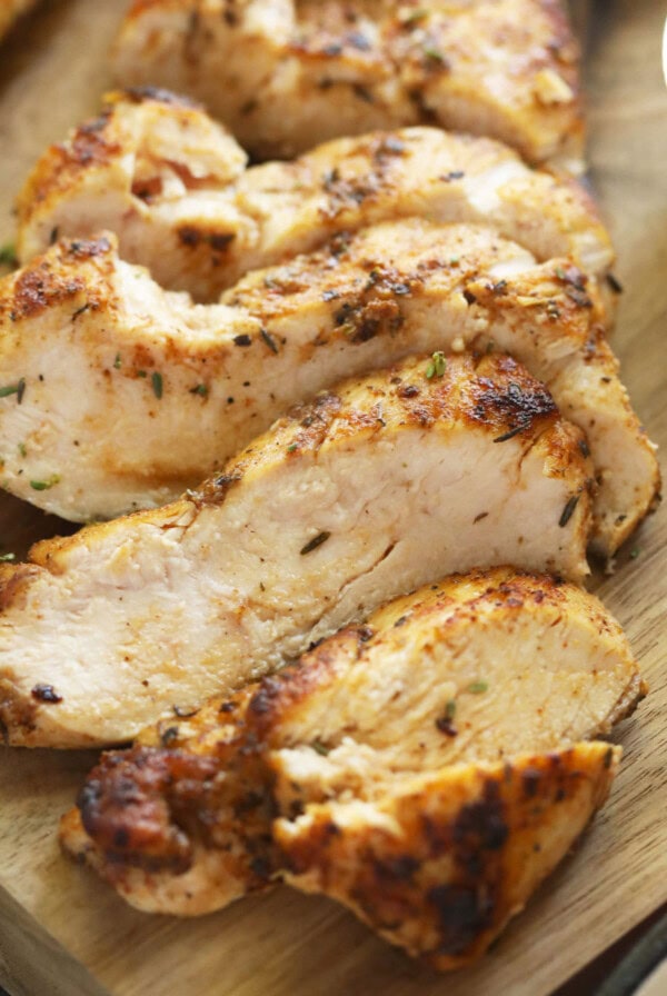 sliced chicken breast on cutting board.