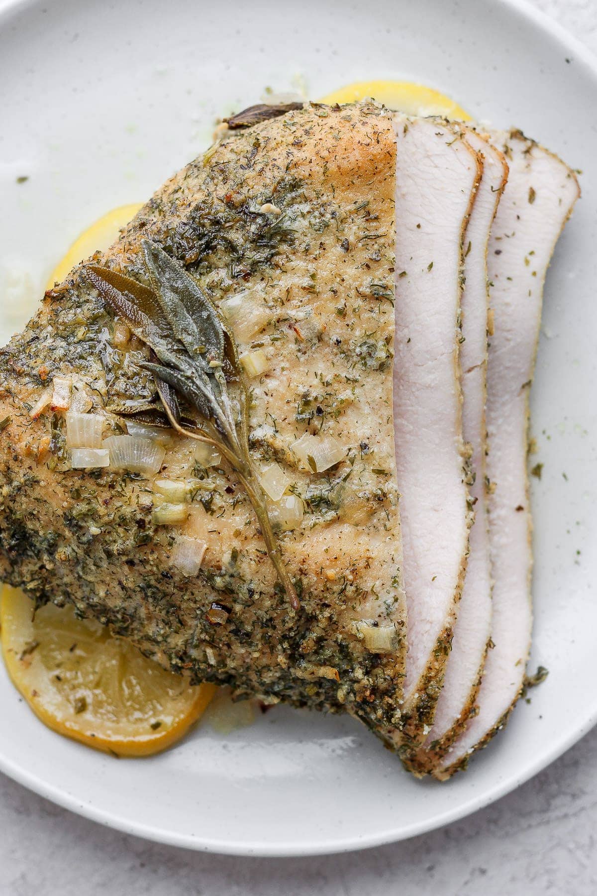Sliced turkey breast on a plate.