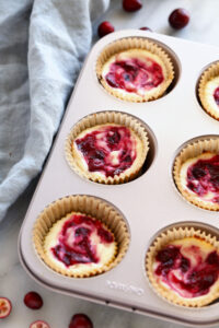 cranberry cheesecakes in a muffin tin.
