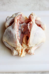 spine cut out of chicken.