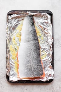 salmon marinating on foil.