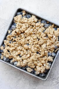 uncooked blueberry crisp in baking dish.