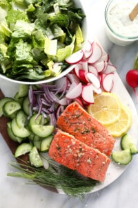 salmon salad with radishes and cucumbers.
