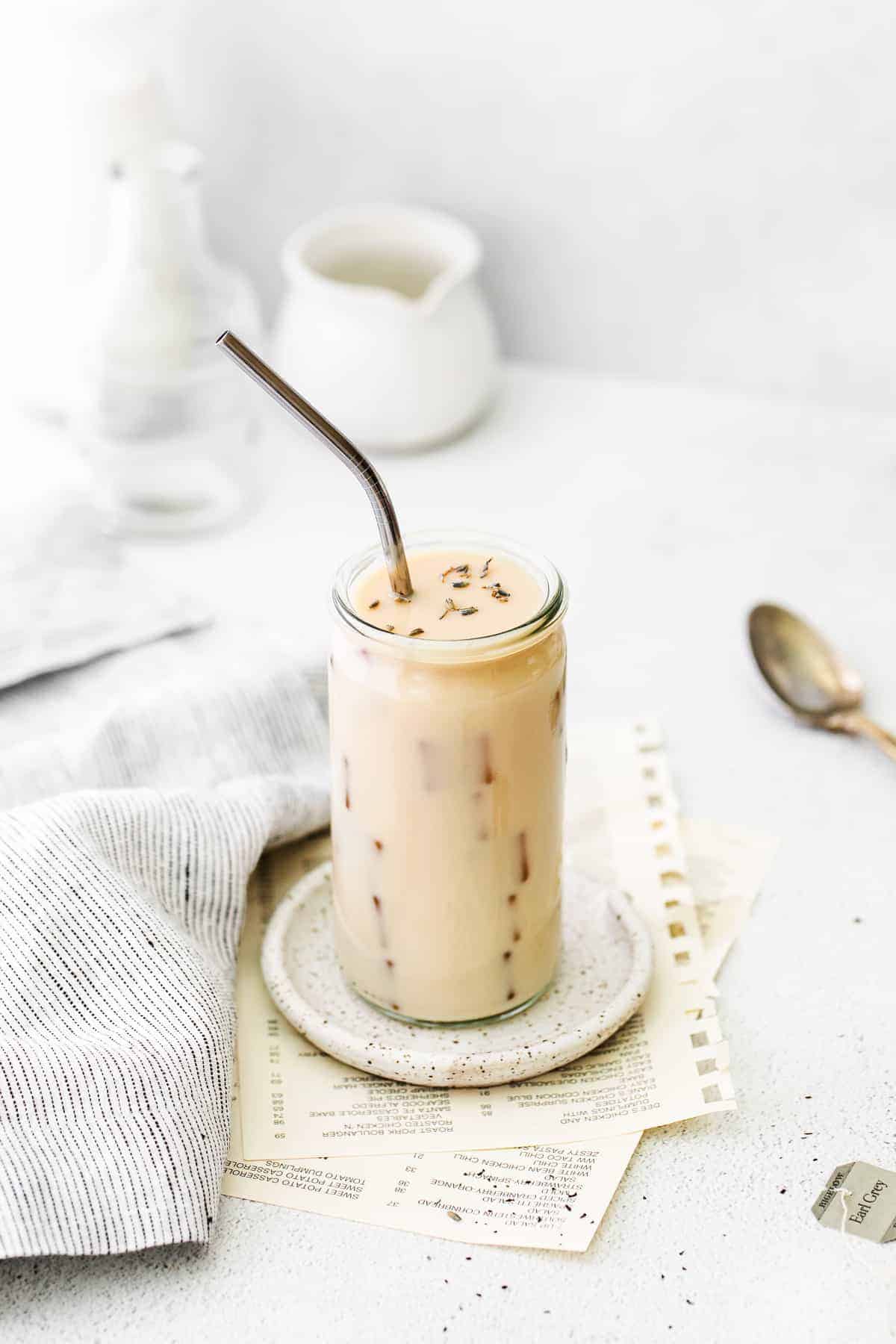 This refreshing Iced London Fog Latte will charge you up for the day. It's made with earl grey tea, a sweetener of choice, and milk. iced london fog in glass