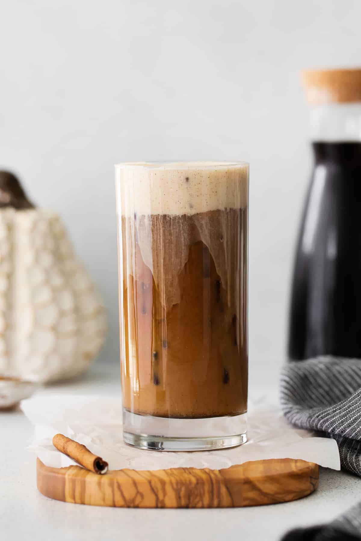Pumpkin Cream Cold Brew in a glass poured over ice. 