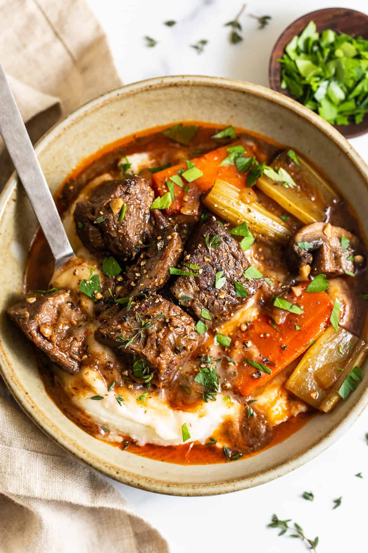 A bowl of Guinness stew served over mashed potatoes.