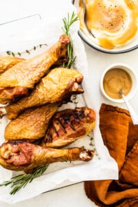 Smoked turkey legs on a platter.