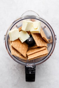 butter and crackers in food processor.
