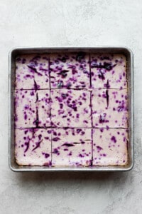 blueberry cheesecake bars in pan.