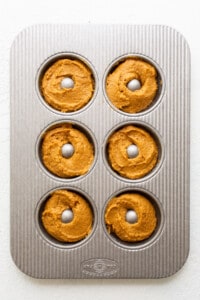 donut batter in donut pan.