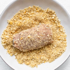 dipping pork chops in breadcrums