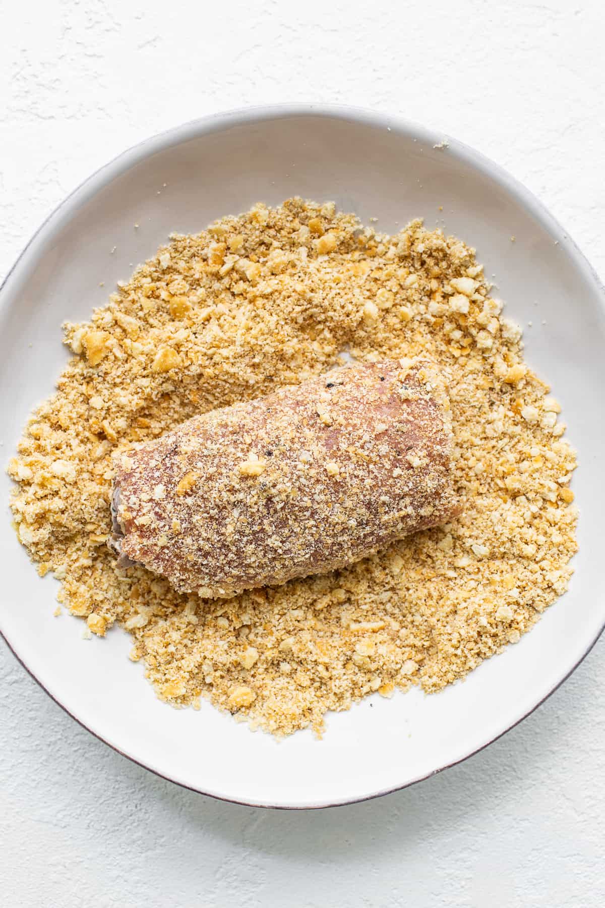 dredging pork chops in Ritz crackers.
