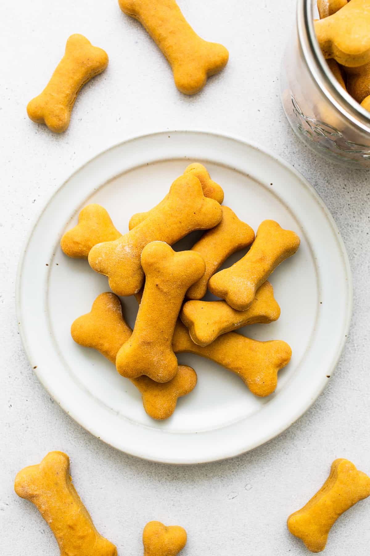 Make a batch of these homemade dog treats for all your furry friends! Made from 5 ingredients, and baked in under 30 minutes. Homemade dog treats on a plate.