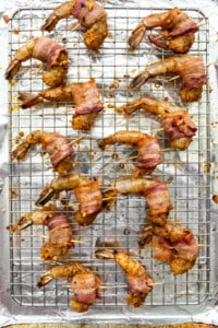 Bacon wrapped shrimp on skewers.
