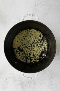 cooking onions in pot.