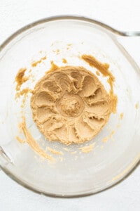 Peanut butter in a glass bowl.