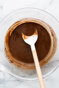 Melted freezer fudge ingredients in a bowl.