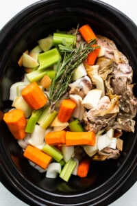 Vegetables and turkey in a slow cooker.
